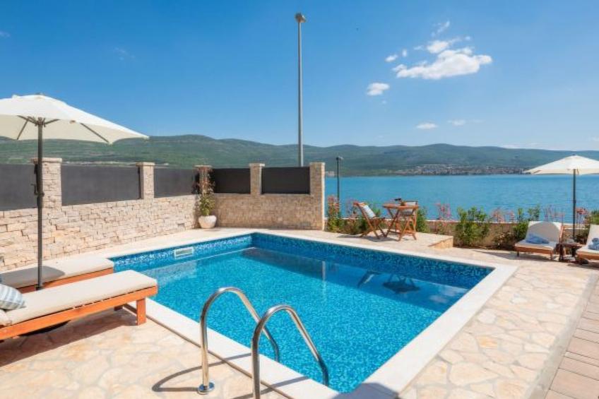 Beachfront villa Noa with heated pool