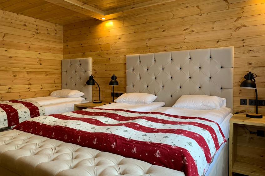 Die Ski-Suite hat ein Schlafzimmer und ein kleines Wohnzimmer ohne Küche. - foto 10