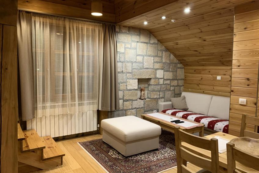 Die Ski-Suite hat ein Schlafzimmer und ein kleines Wohnzimmer ohne Küche. - foto 44